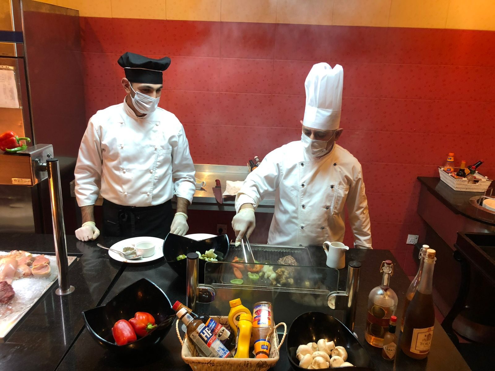 Crescent Beach chefs at a live cooking station